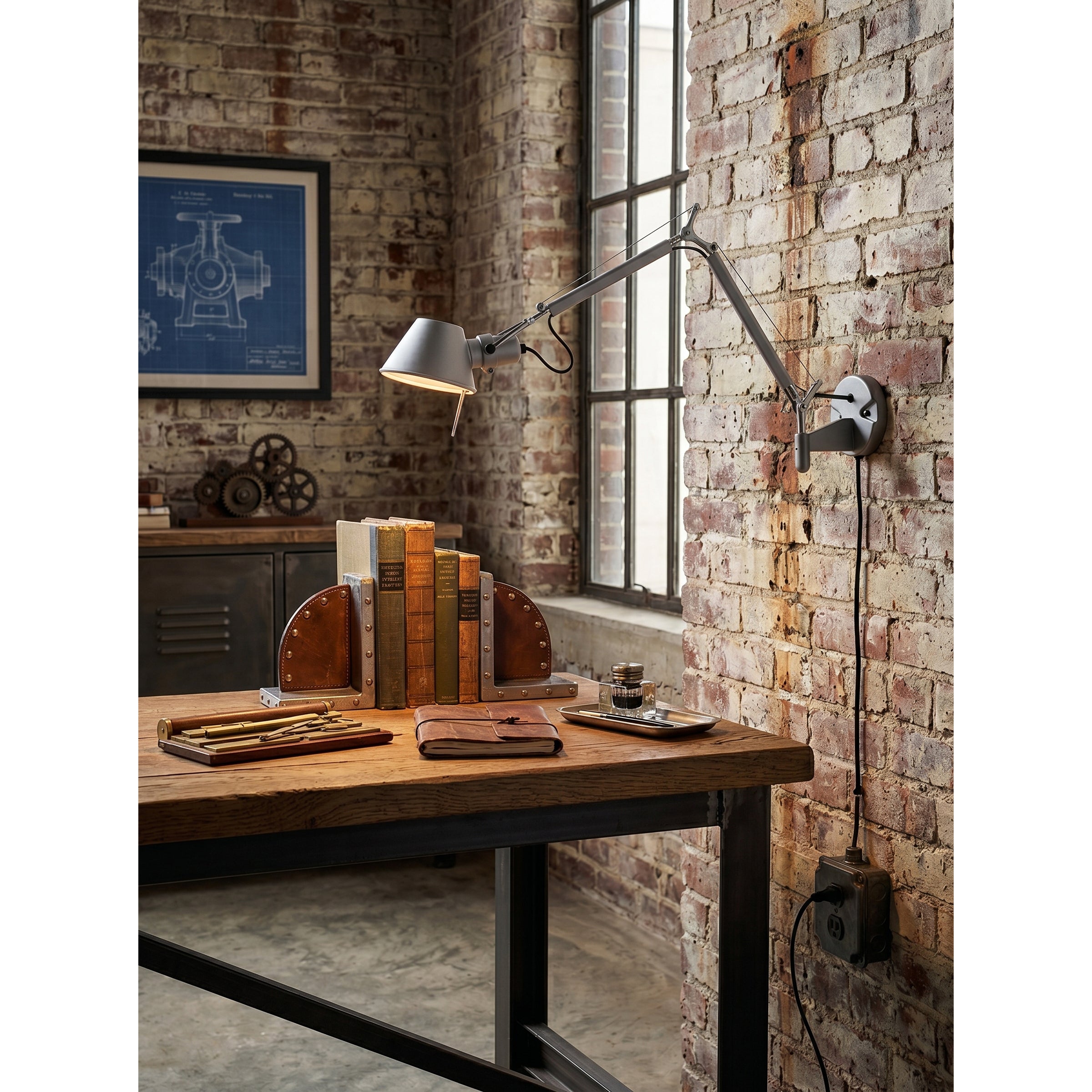 The Brady sconce from a low angle, emphasizing its modern form.