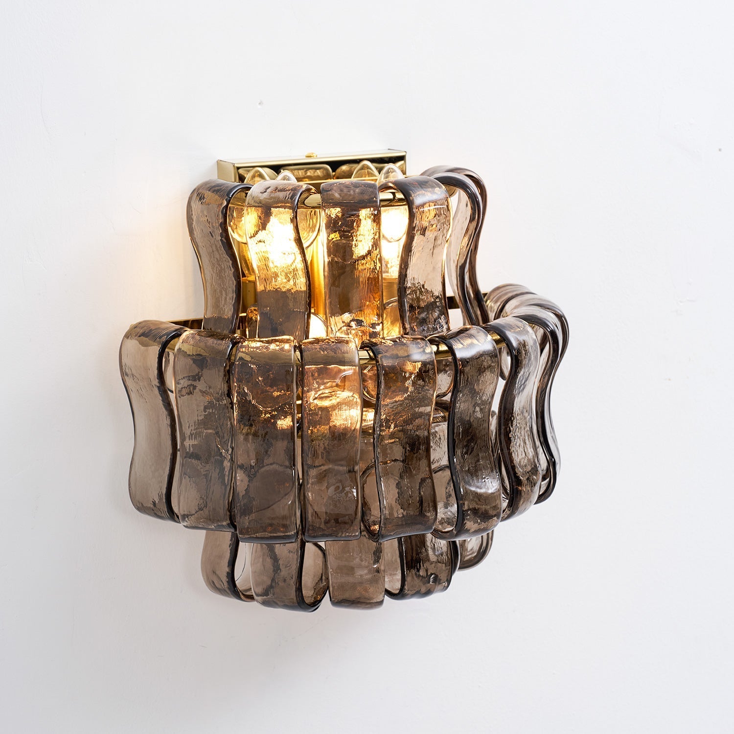 The light pattern cast by the ribbed glass of the Albano Wall Lamp.