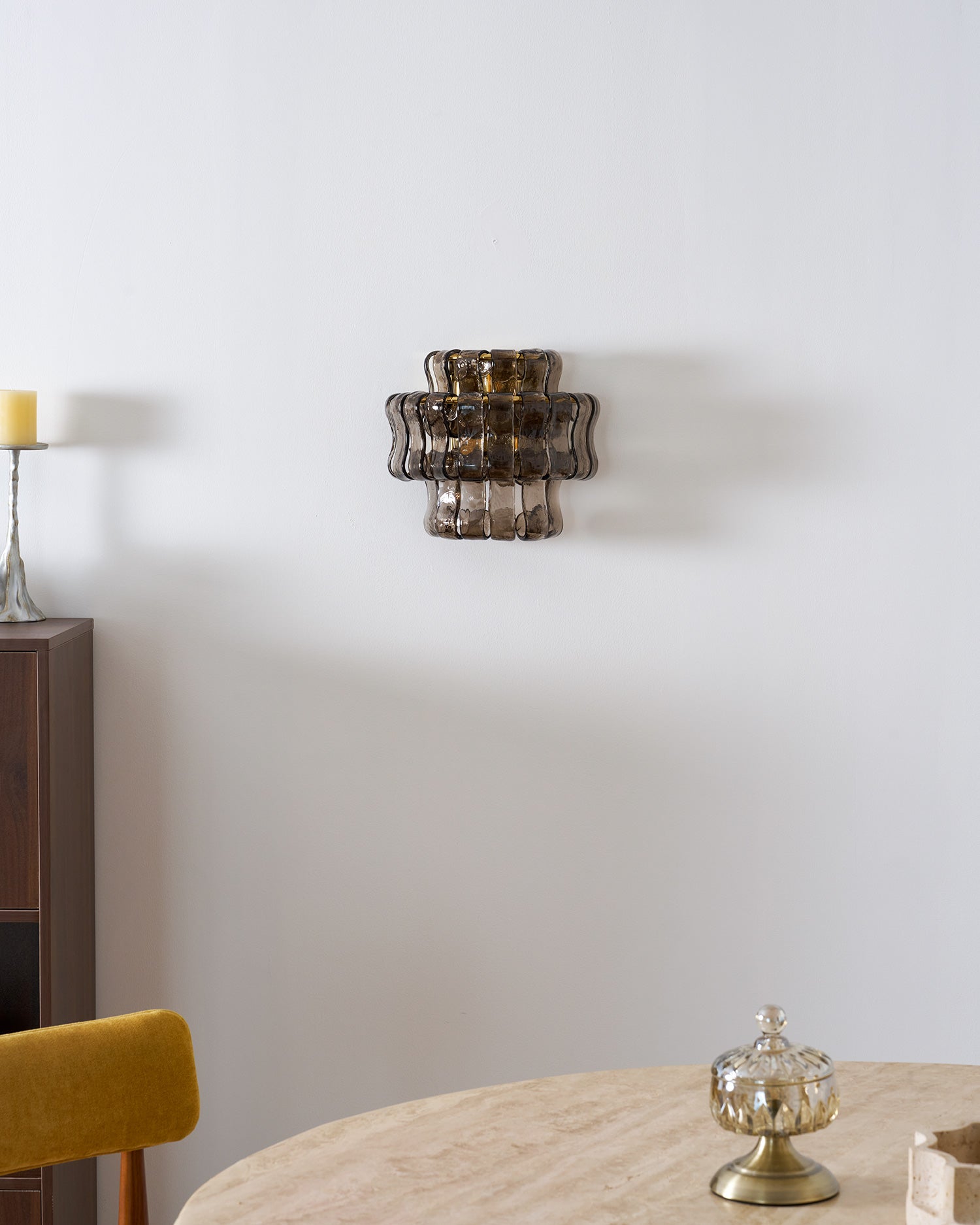 Angled shot of the green glass Albano Wall Lamp.