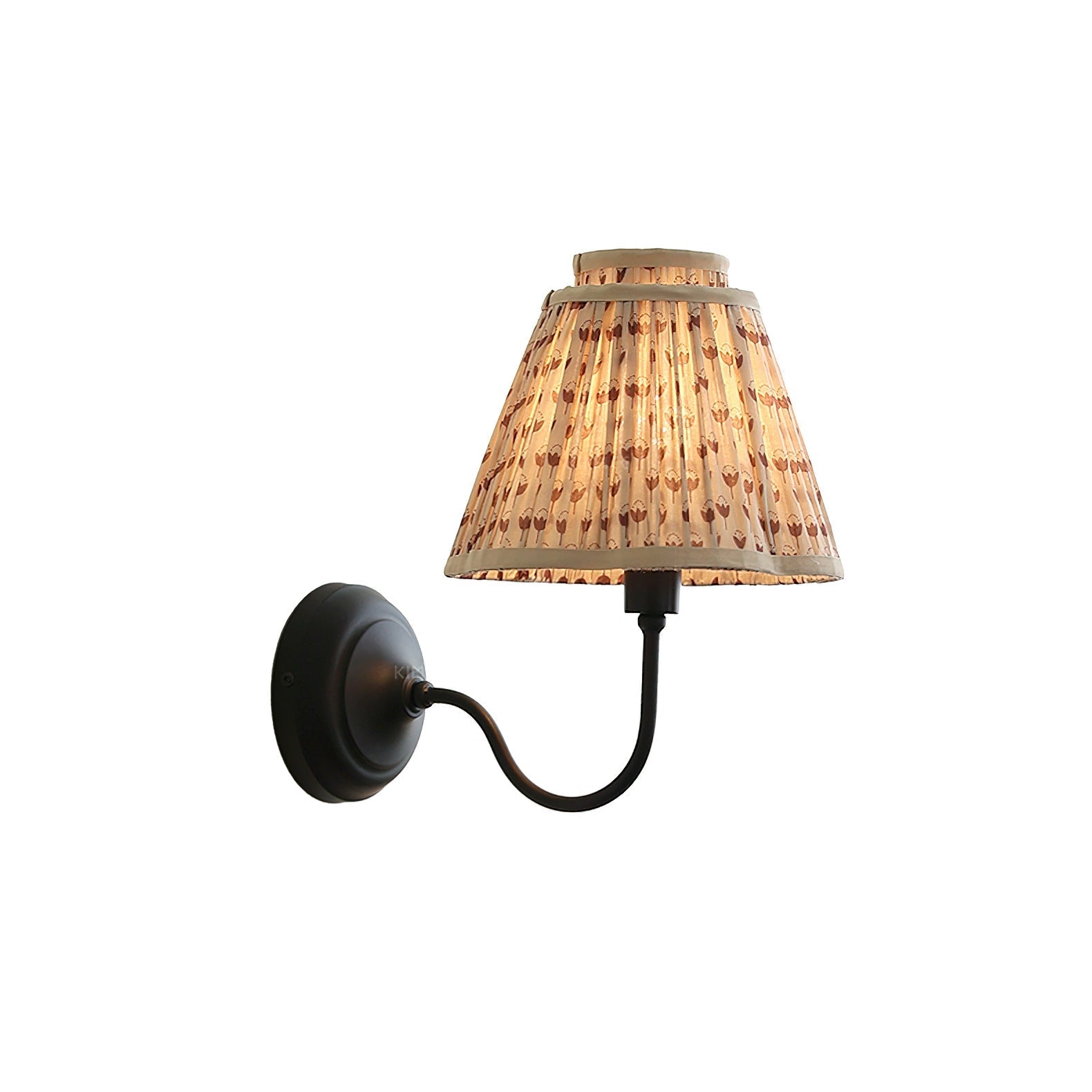 Elbow Wall Light with a light brown floral shade against a plain wall.