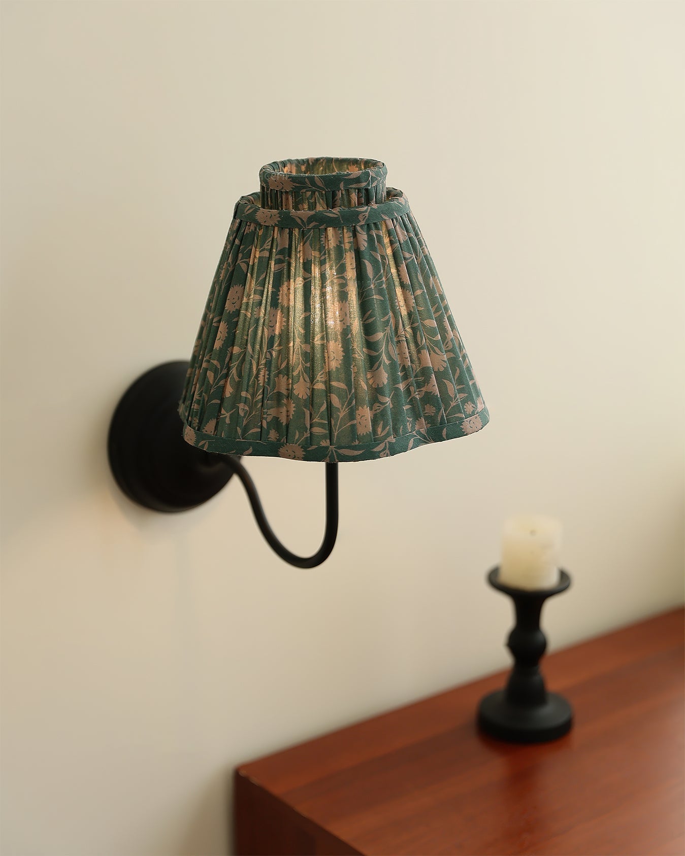 Angled view of the light brown and black version of the Elbow Wall Light.