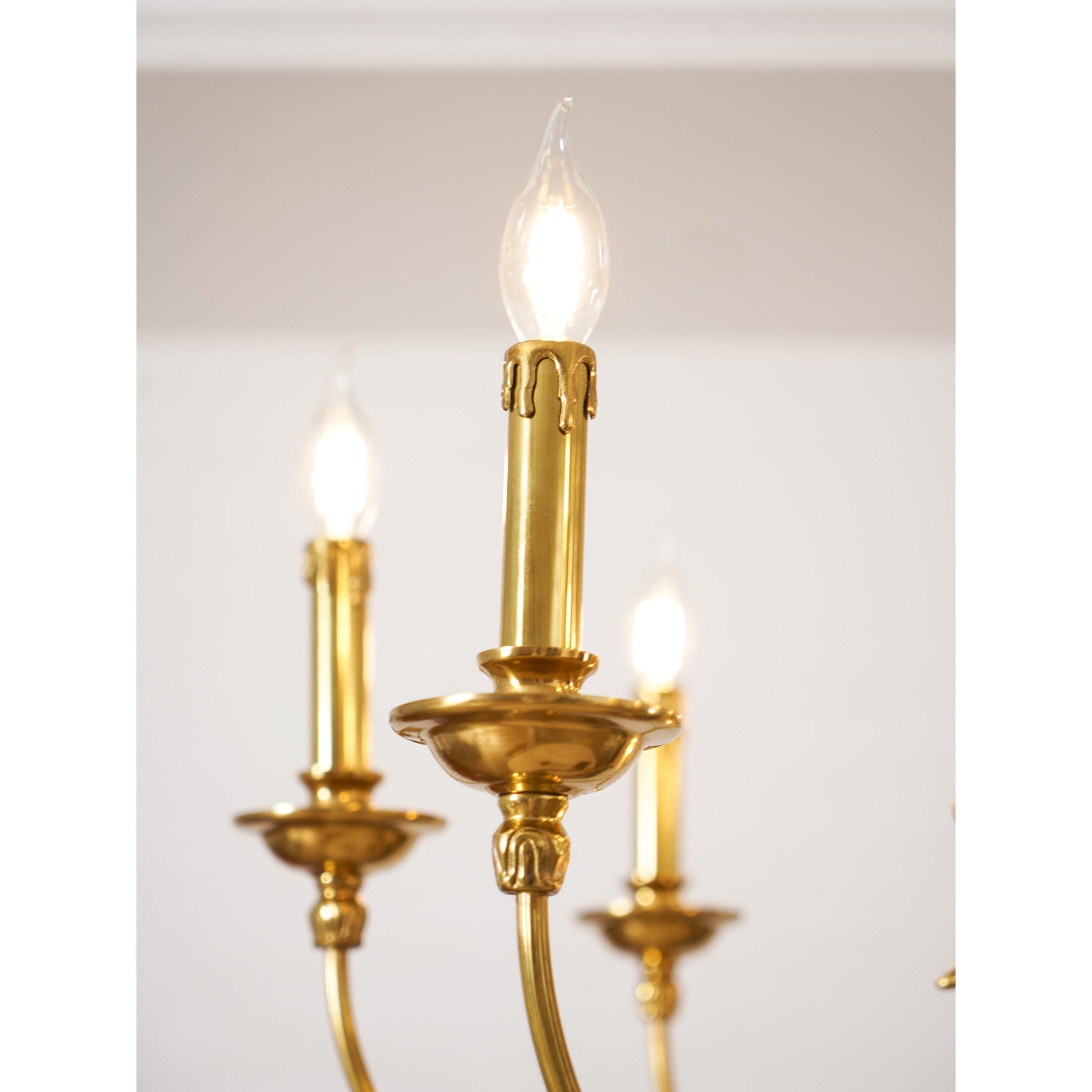 The 6+1 arm version of the Ashford Brass Chandelier in a formal dining room.