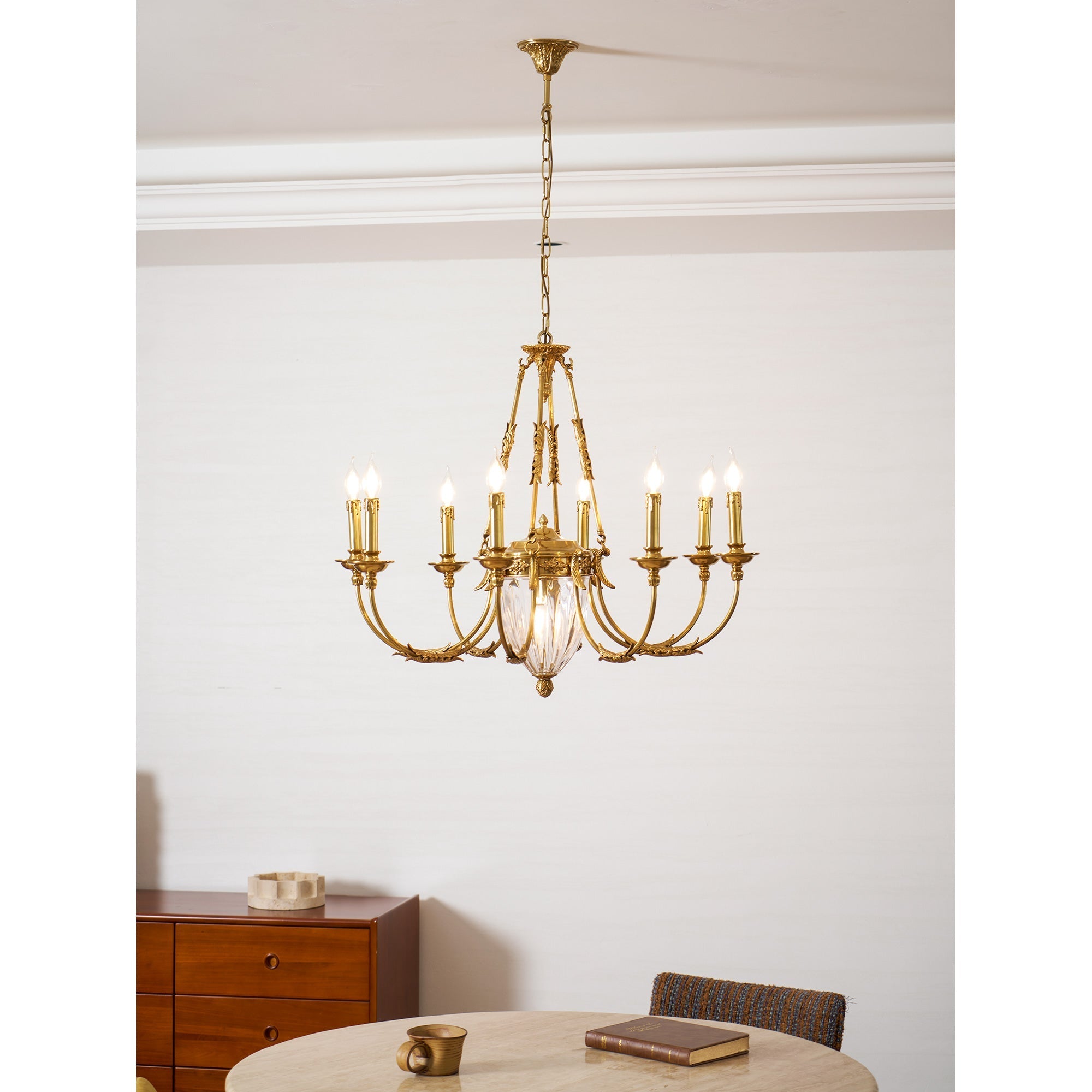 The intricate cut facets of the central crystal pendant.