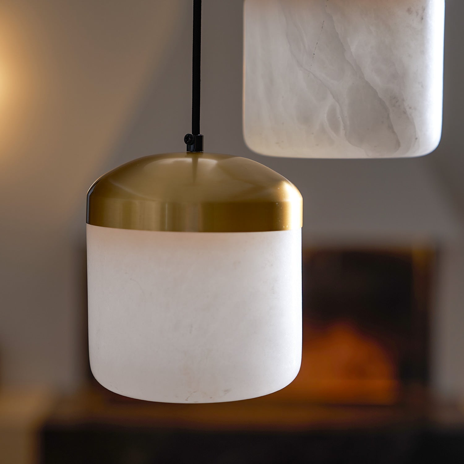 The warm light emitted from the Asta alabaster shade.