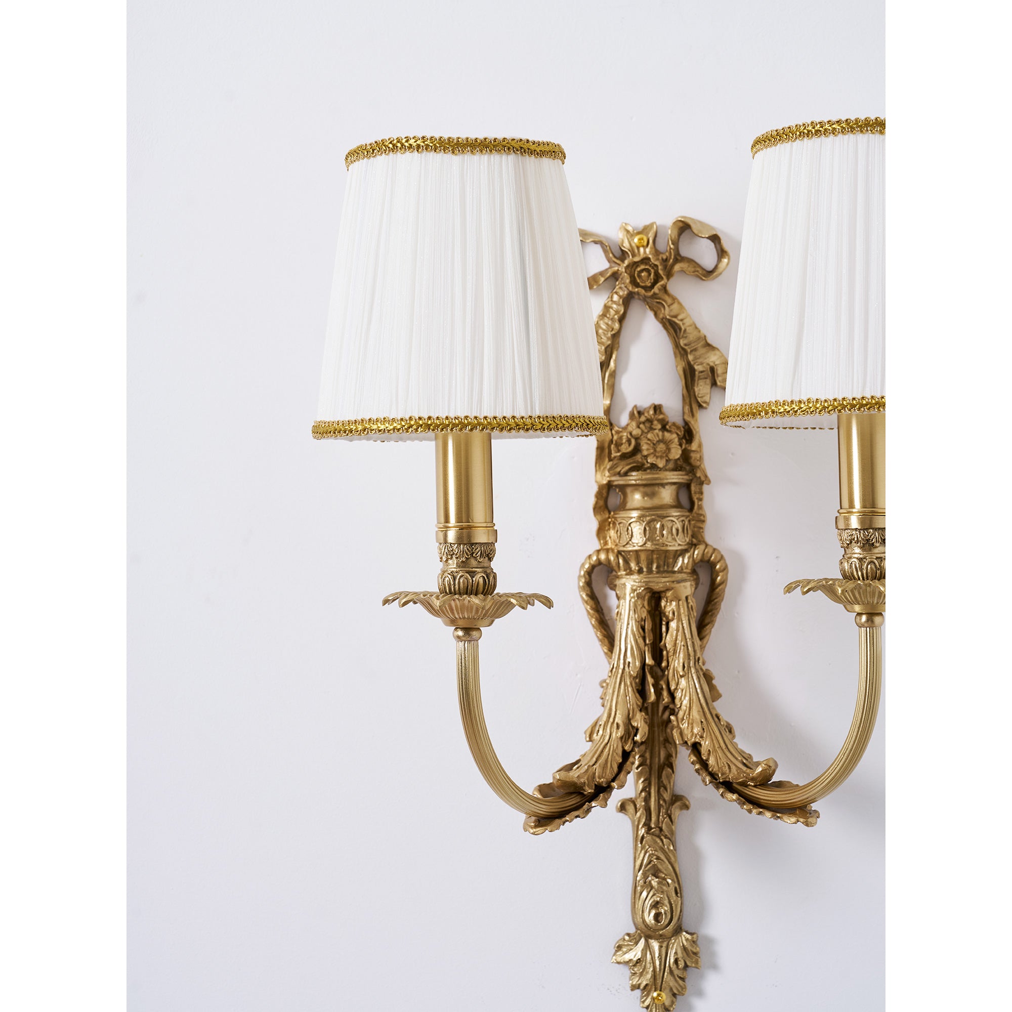 The Claudine Wall Lamp in a dining room setting.