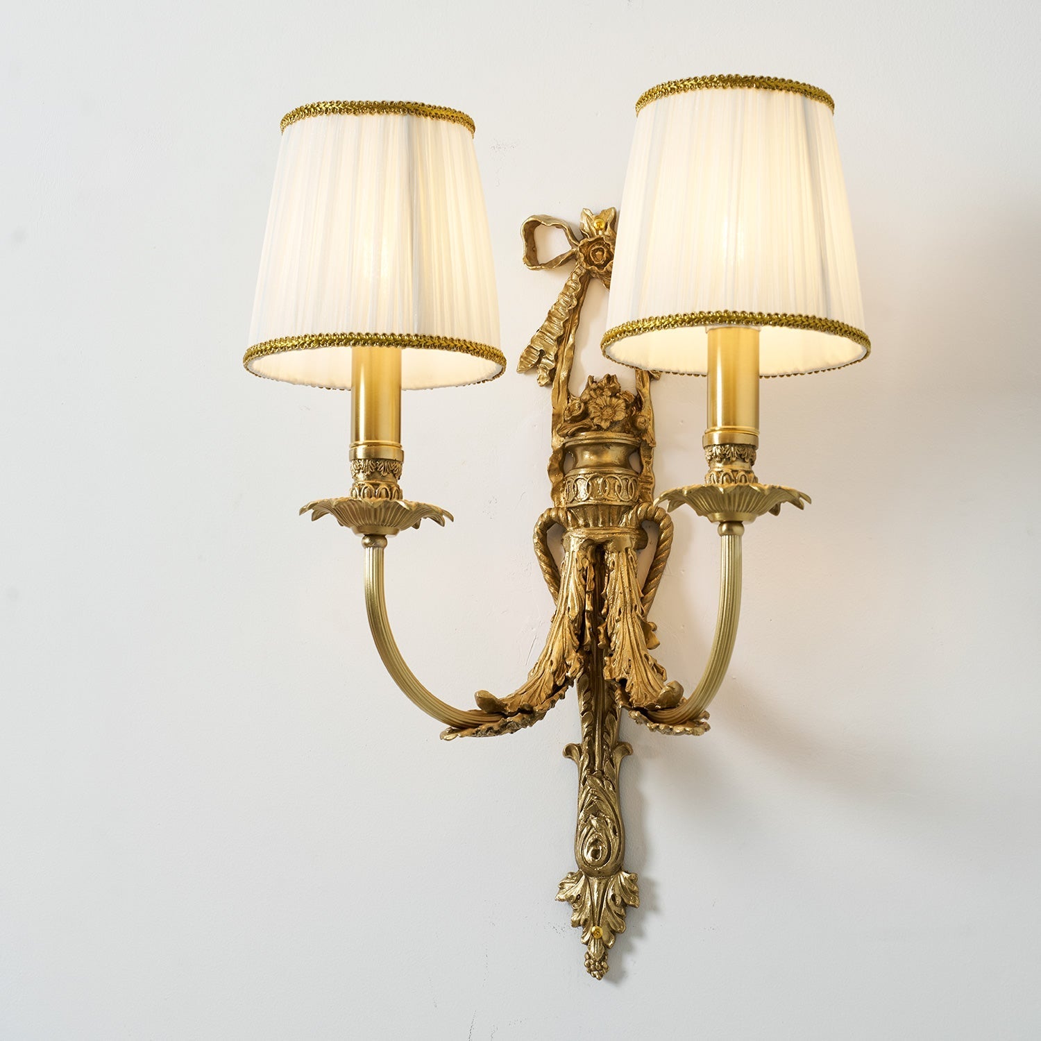 The elegant silhouette of the Claudine Wall Lamp.