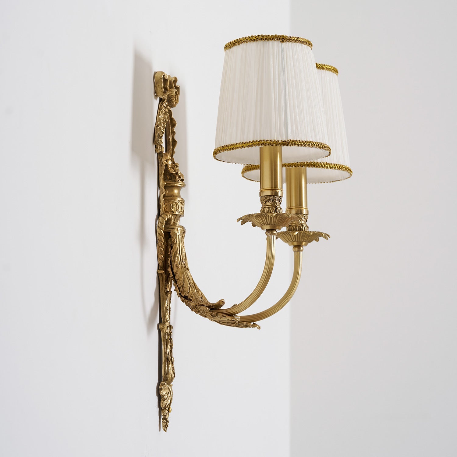 The Claudine Wall Lamp as part of a gallery wall.
