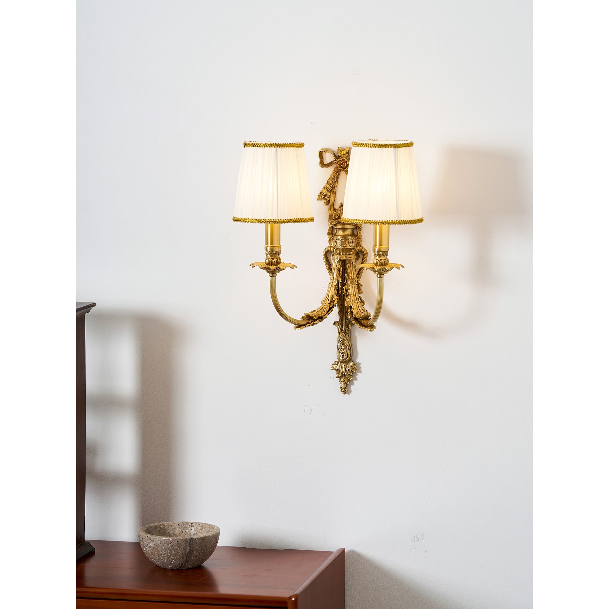 A full-room view with the Claudine Wall Lamp as a feature.