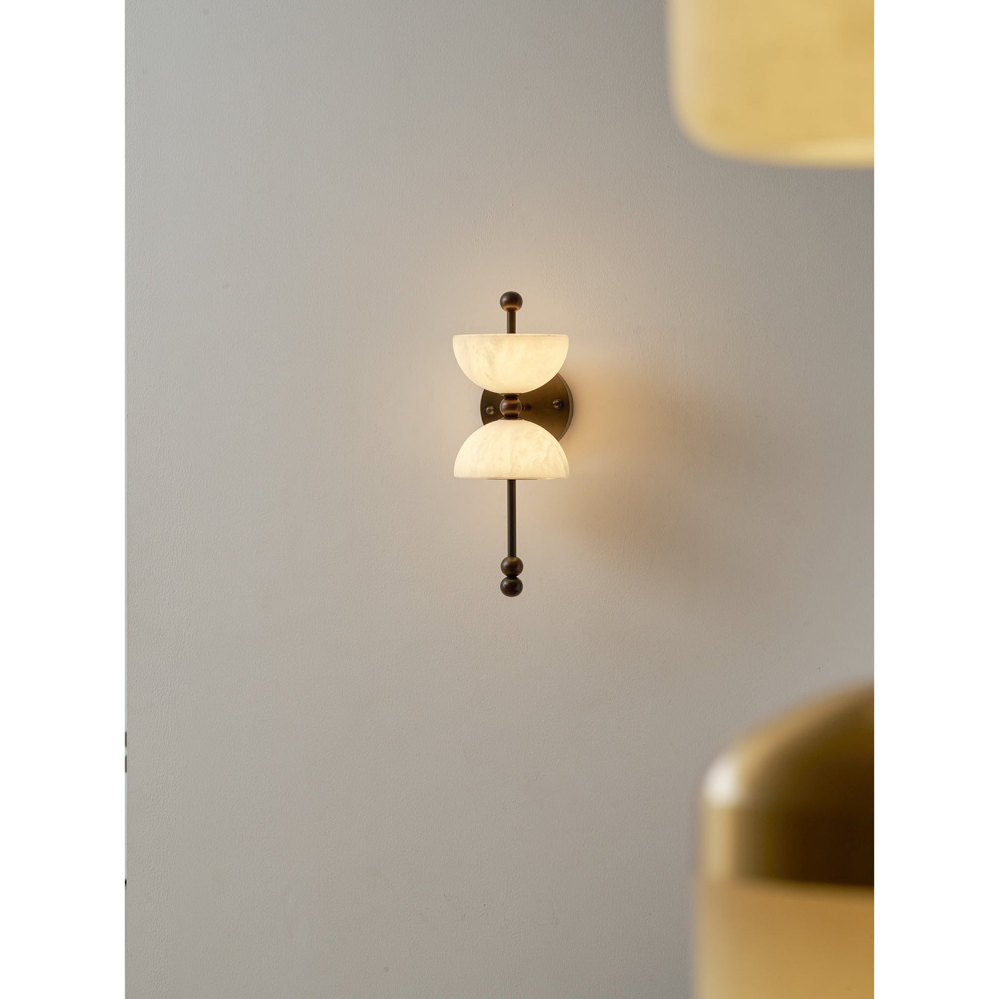 Lyra Wall Lamp in a minimalist hallway.