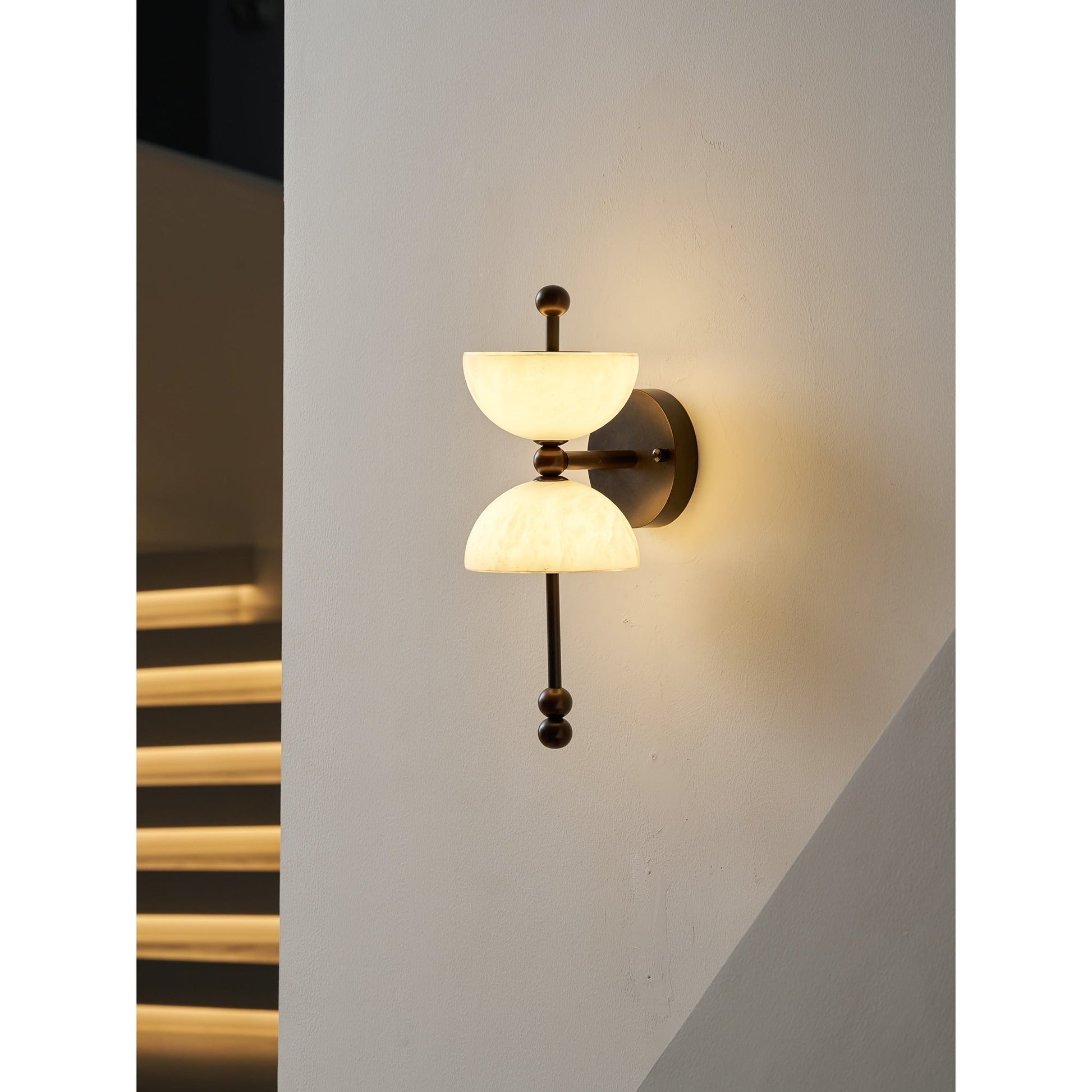 The lamp shown against a dark background to emphasize its form.