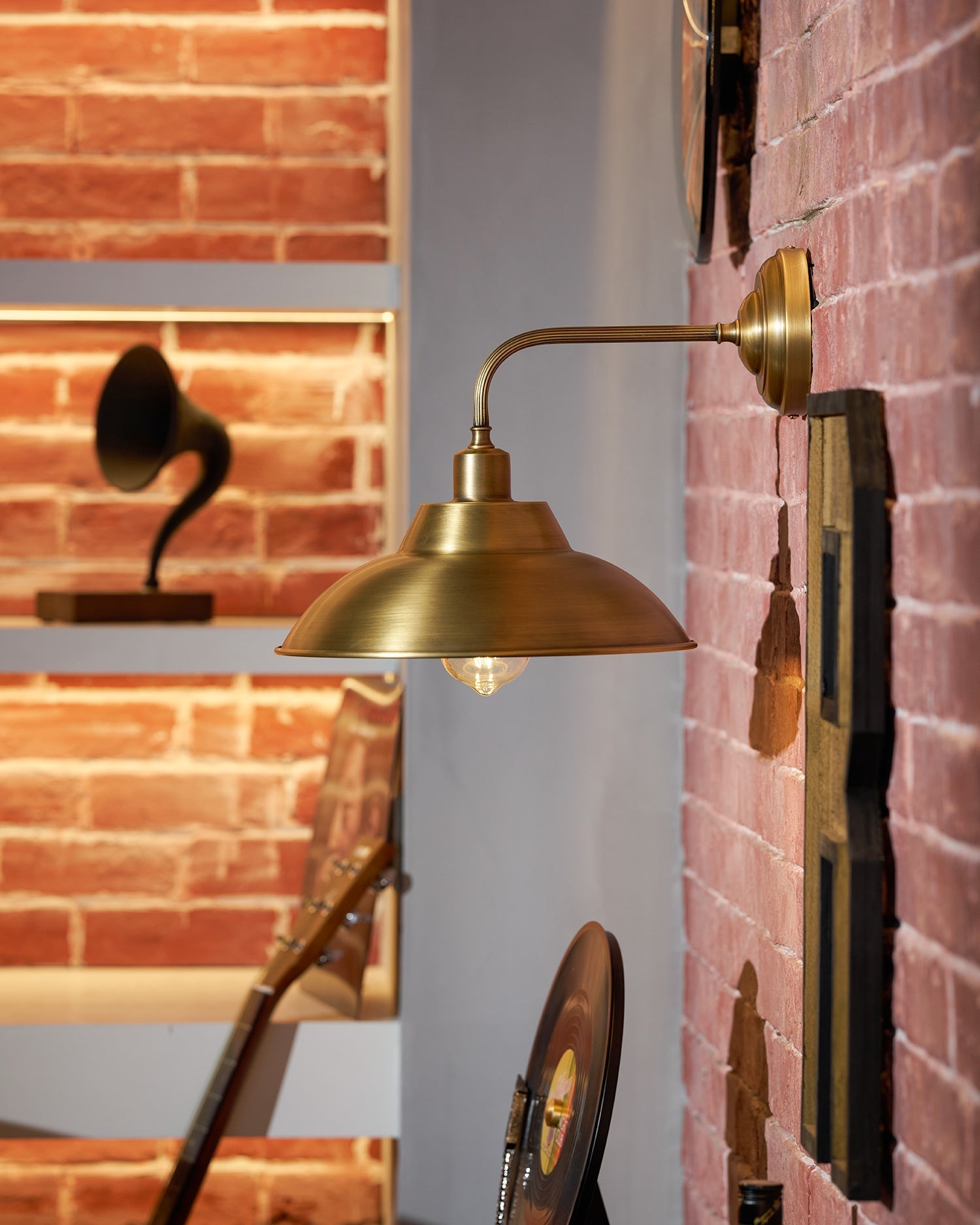 Aldorno Wall Sconce shown with an Edison-style bulb.